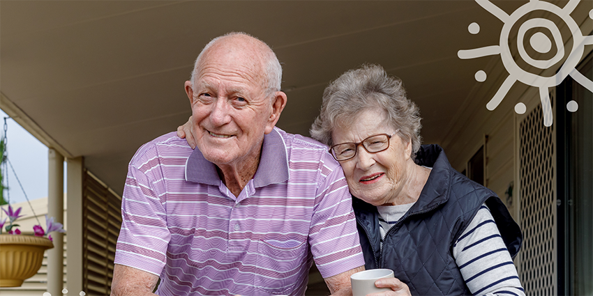 An older couple, smiling.