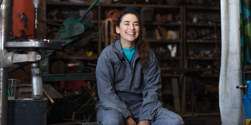 Young woman in blue boiler suit
