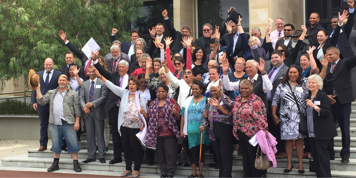 Noongar people and Noongar Elders celebrating Traditional Owner recognition on the steps of the WA Parliament. Koorah, Nitja, Boordahwan (Past, Present, Future) Recognition Act 2016.