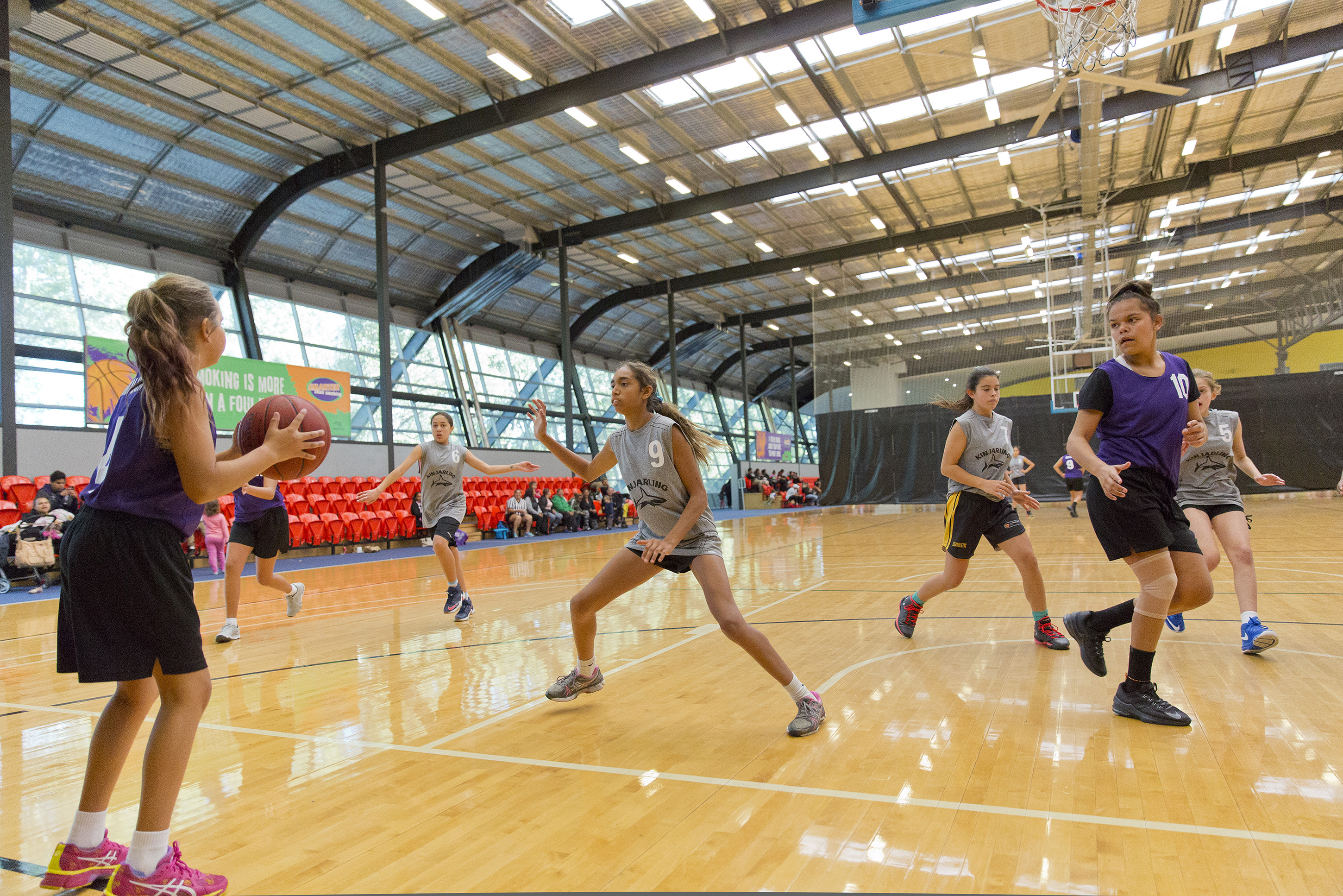Young Indigenous girls playing basketball