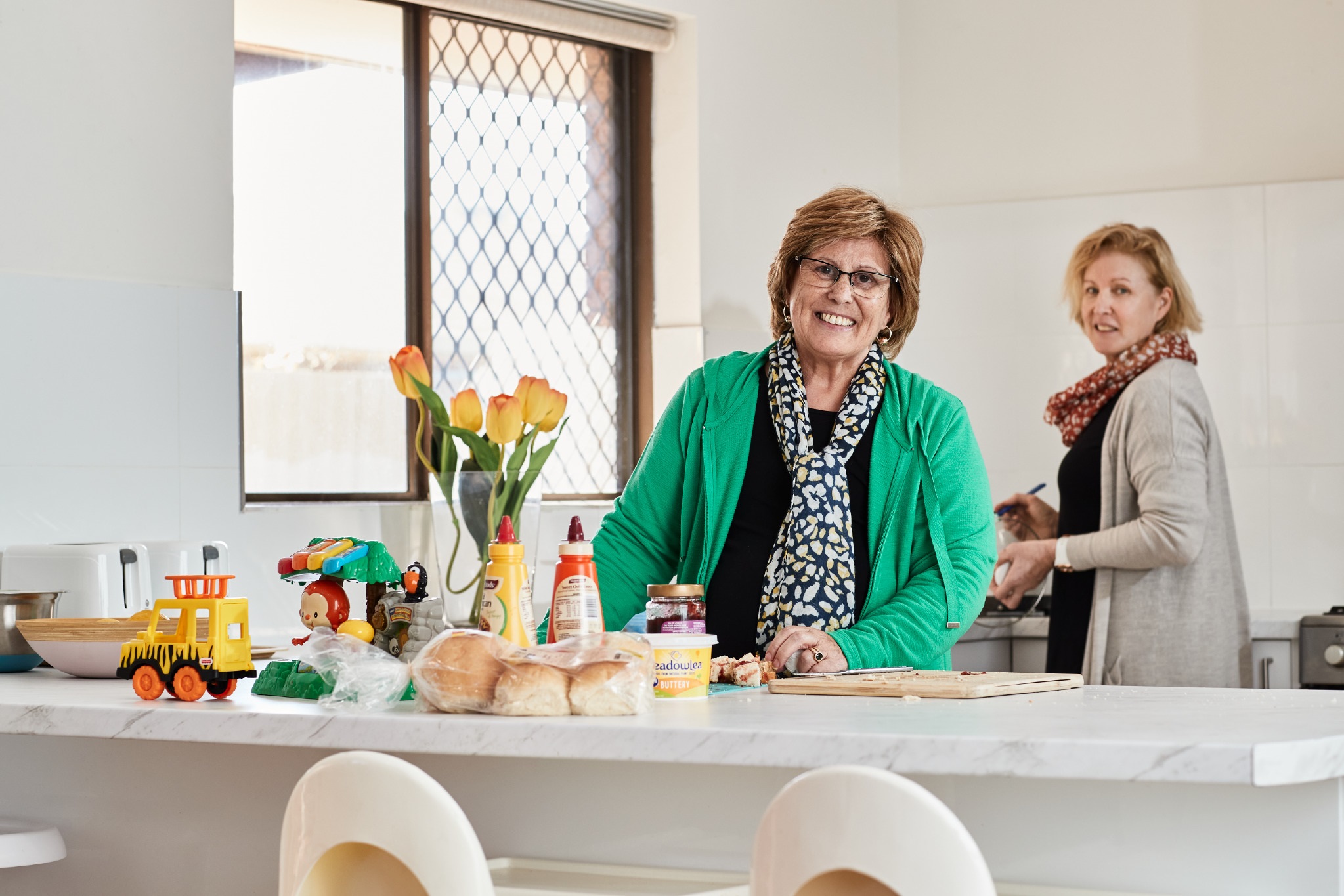Women in kitchen preparing food 