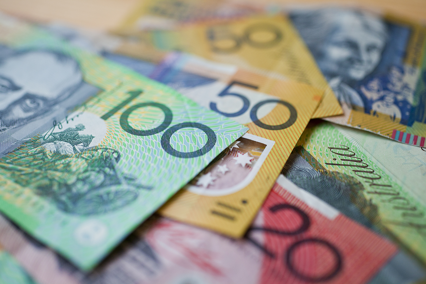 A pile of Australian currency with a shallow depth of field.