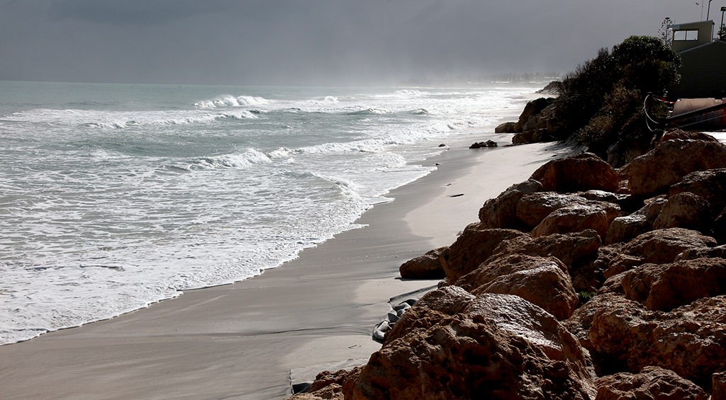 coast of beach with gloomy skies