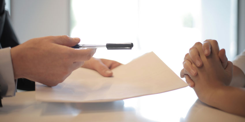 Lawyer offering client to sign