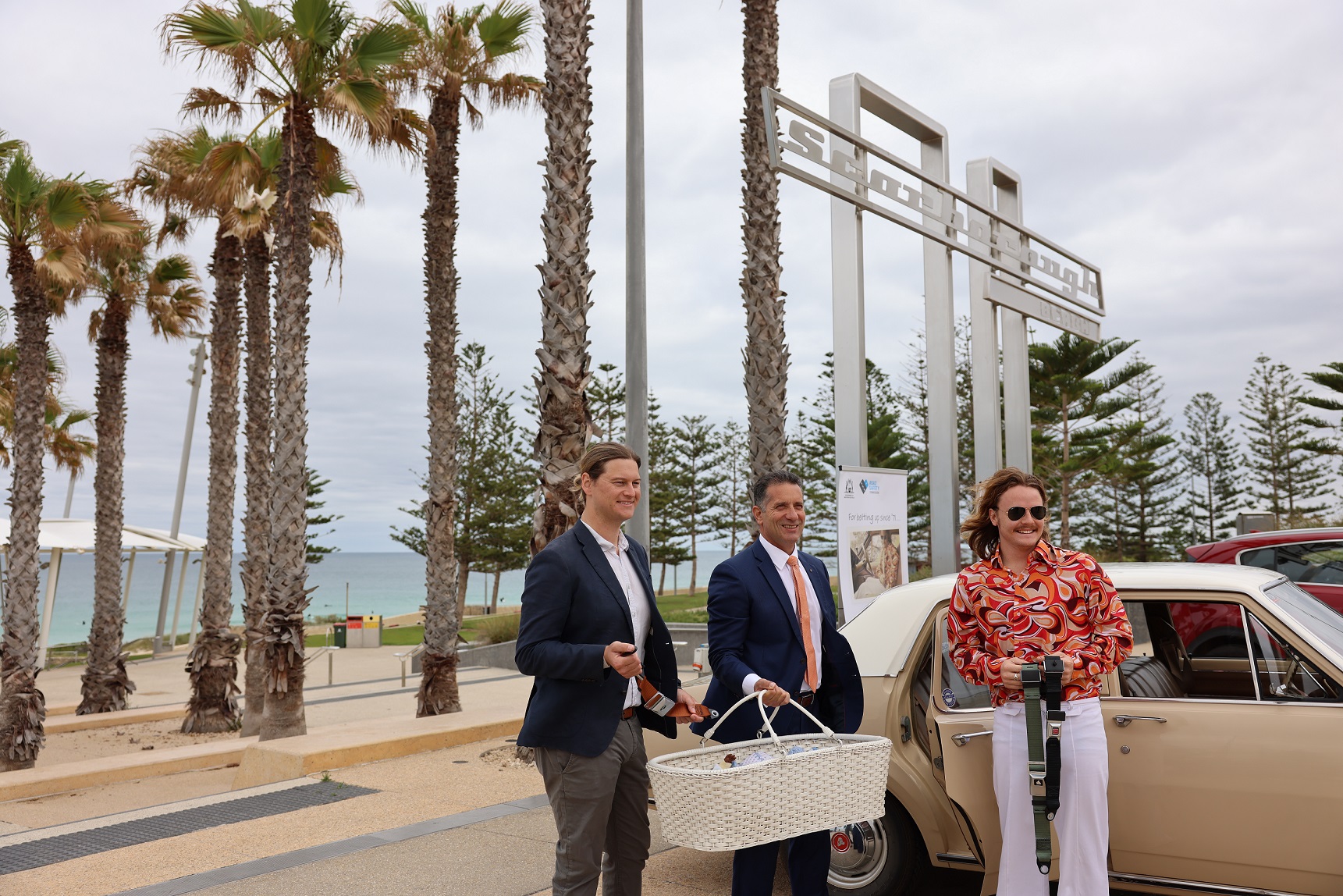Minister and local MP Stuart Aubrey take a step back in time with baby in bassinet in back seat of car