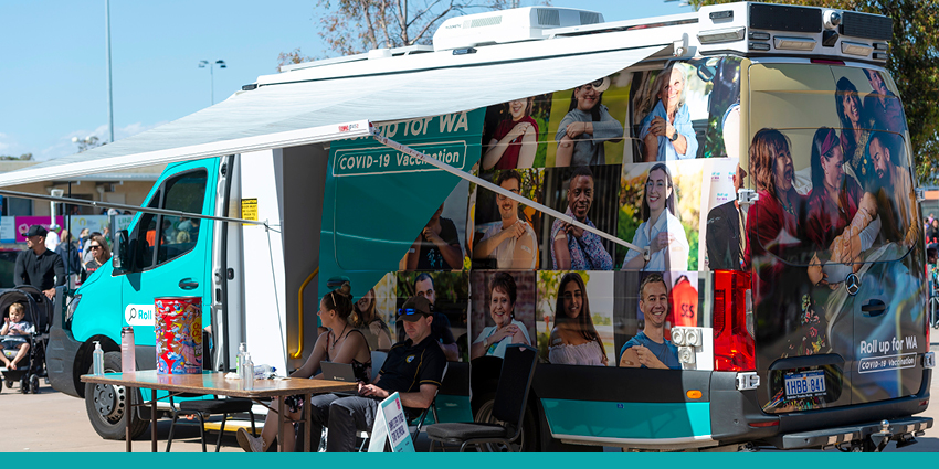 A parked Roll up for WA COVID-19 vaccination van.
