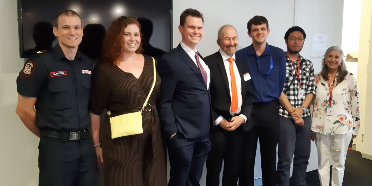 Dr John Byrne with representatives of DFES