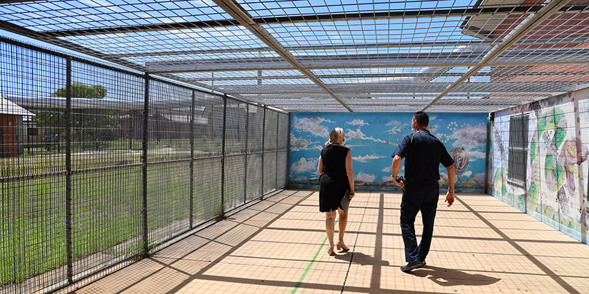 The ISU’s enclosed recreational area secures detainees while providing sunshine and fresh air. A planned revamp includes replacing the overhead barrier with shade cloth.