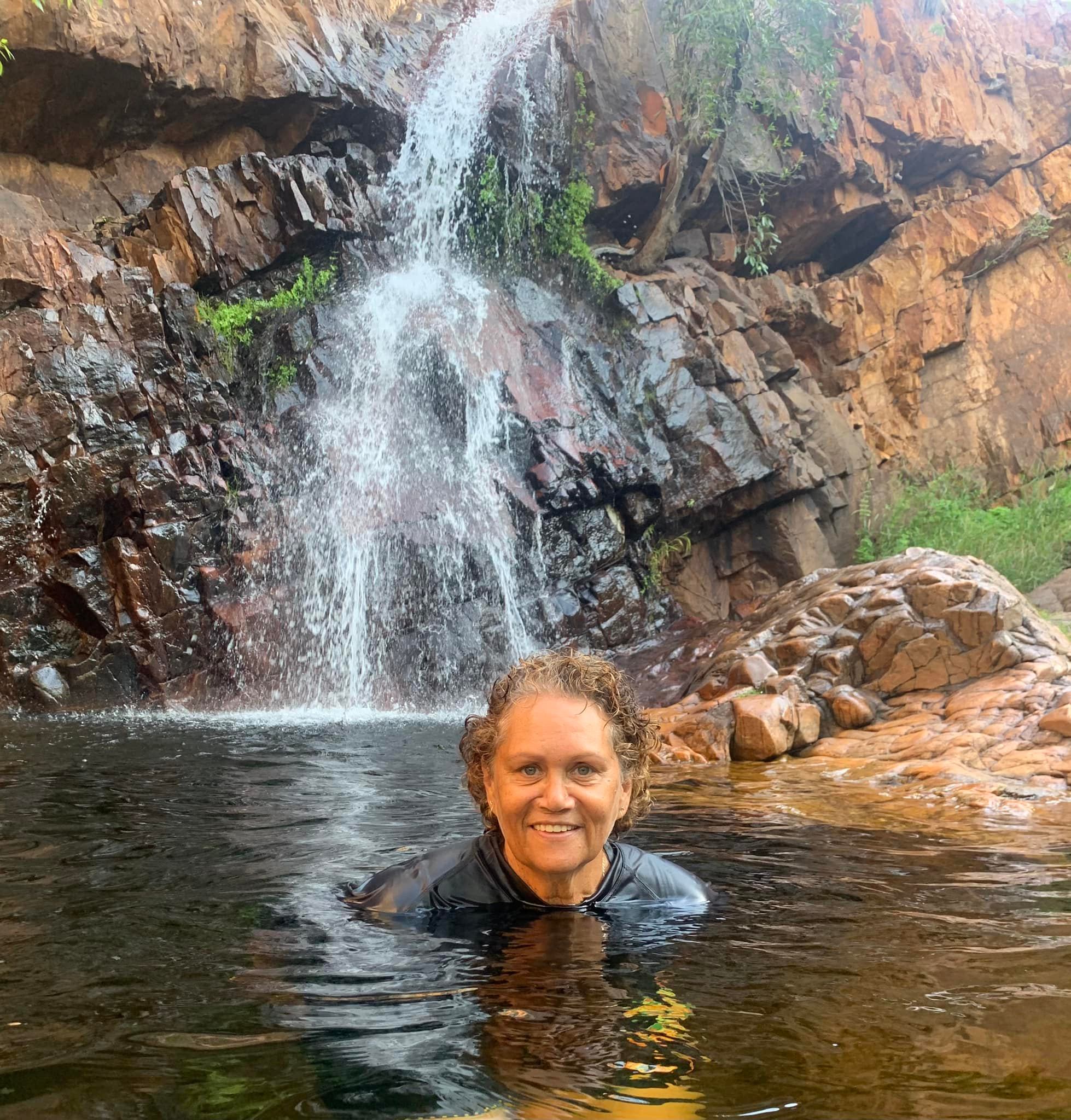 Image of Department of Communities’ Glenice Smith in a culturally significant place in the Kimberley region of WA