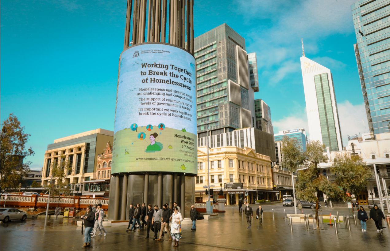 Yagan Square, City of Perth Northridge Piazza showcasing Homelessness Week poster that reads "Working together to break the cycle of homelessness."