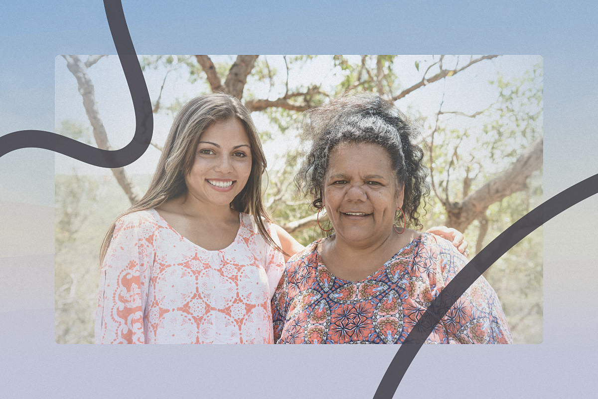 Two Aboriginal women smiling for a photograph