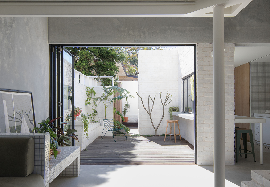 Photographs of a house with a sunny courtyard designed by Whispering Smith Scarborough