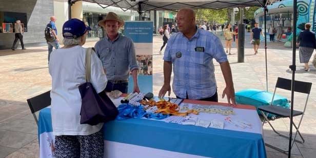 Commission officers at the stall in the mall
