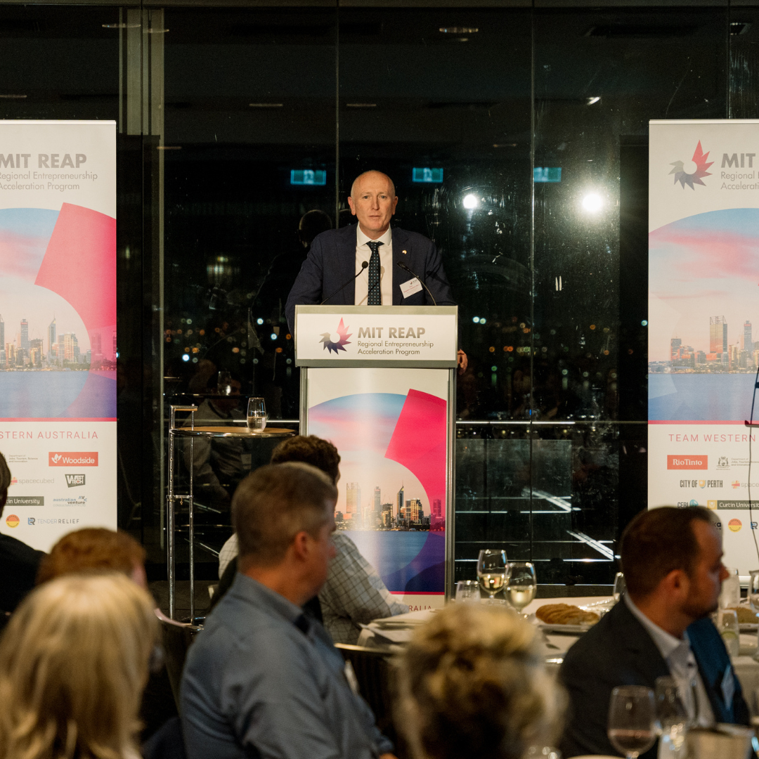 Stephen Dawson talking at the podium at the MIT REAP Gala Dinner