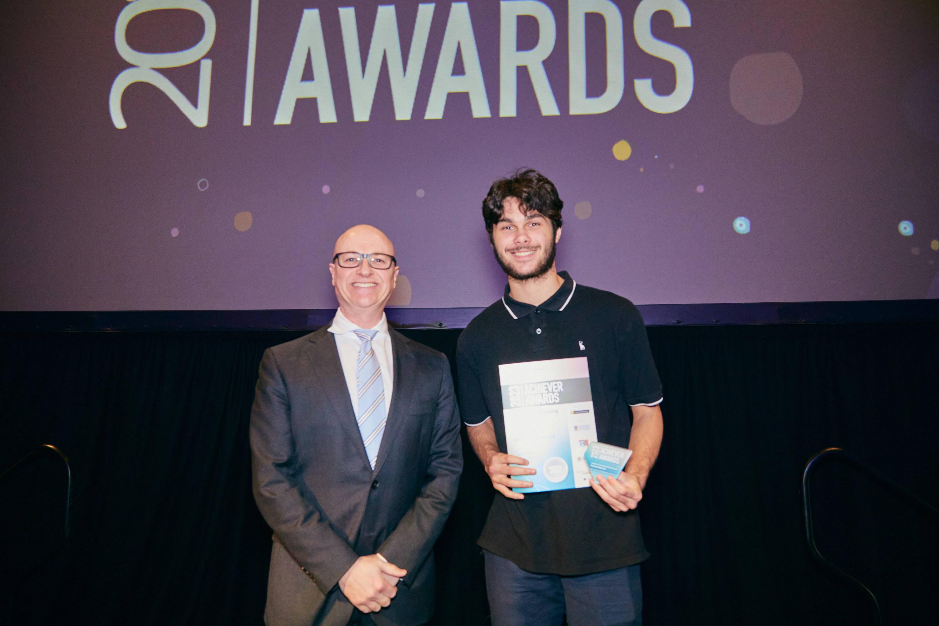 photo of Communities Director General with Community Spirt Award winner Randall Manolis
