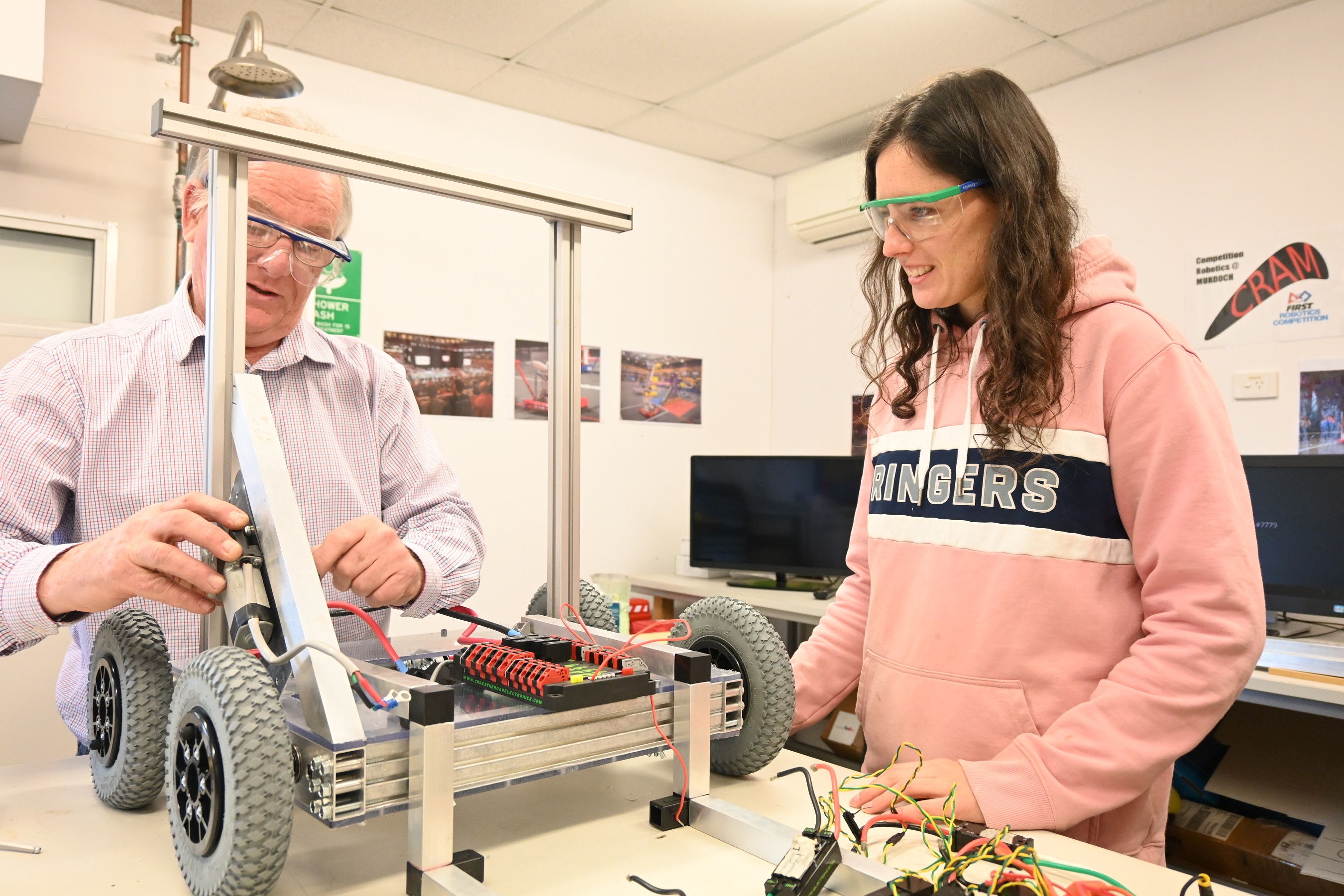 Dr Berryman and Victoria Ledger (student) in Murdoch robot lab building a robot