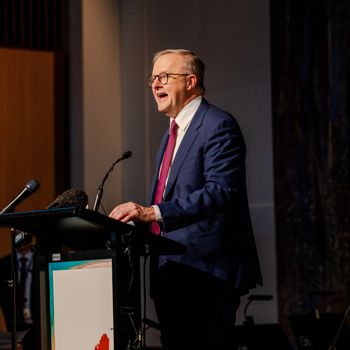 Prime Minister Anthony Albanese talking at the podium. 