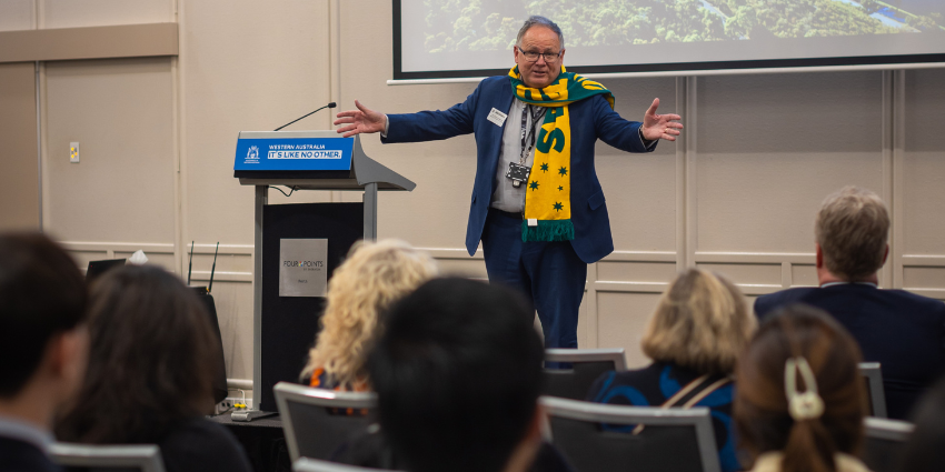 Minister Templeman is addressing the crowd at the International Student Scholarship Awards ceremony