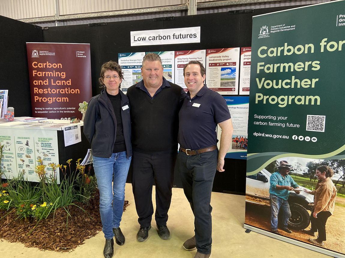 Three DPIRD Low Carbon Futures staff in front of field day display