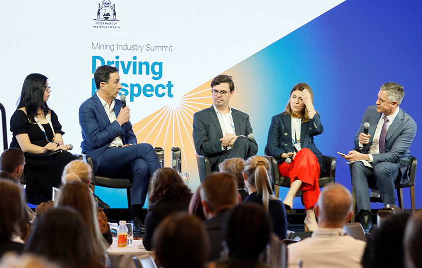 Five people fronting a panel discussion