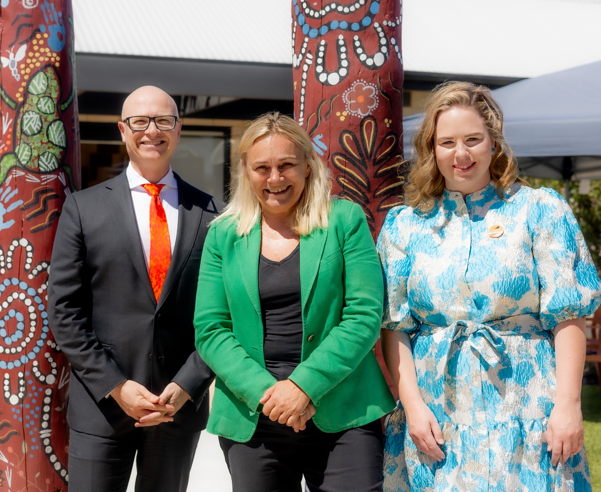 Group photo of Communities DG Mike Rowe, Minister Winton and Kelda Oppermann
