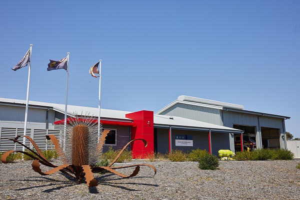 Northampton Volunteer Fire Rescue Service building. A sculpture of a banksia flower is in front of the building.