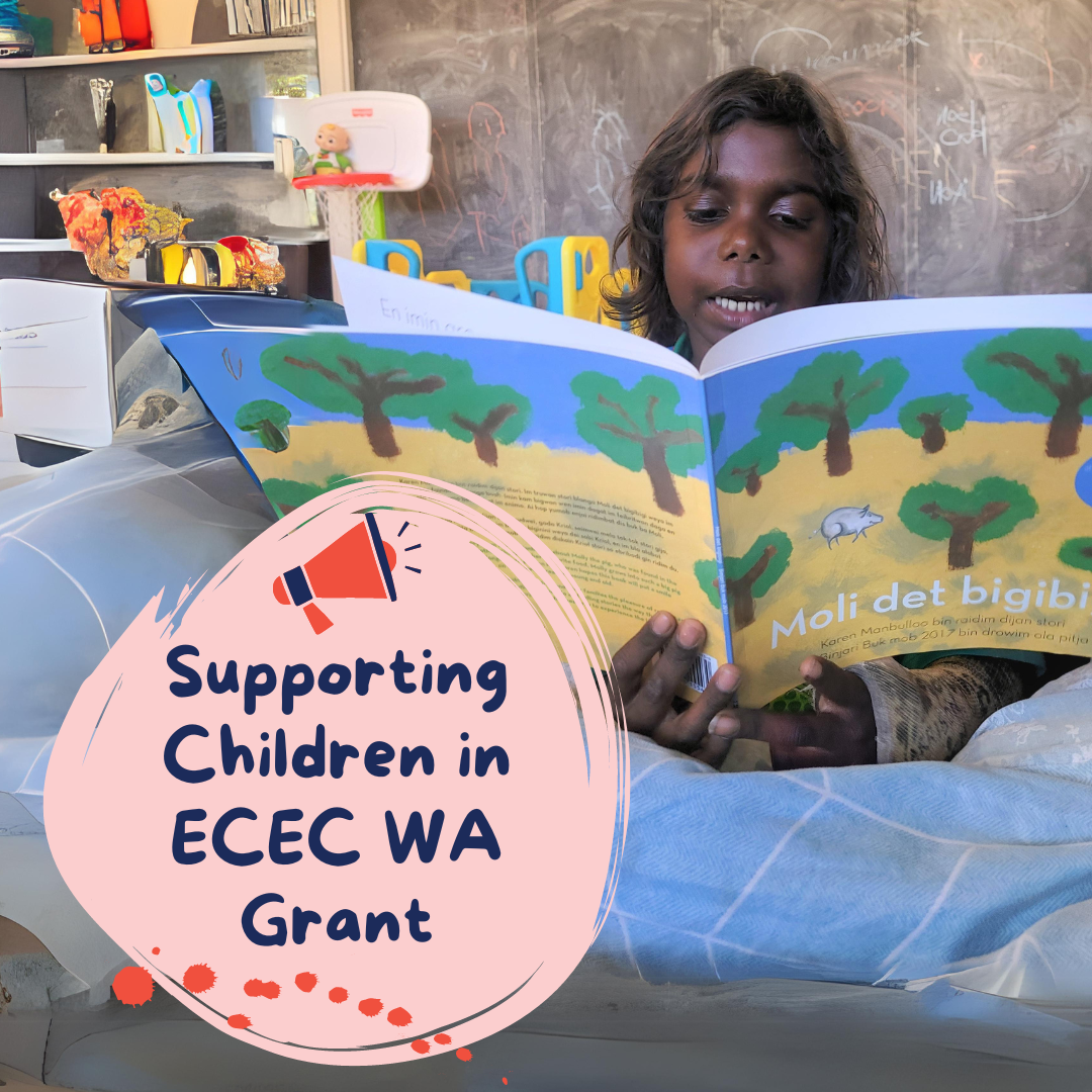 photo of a young Aboriginal child reading a book 
