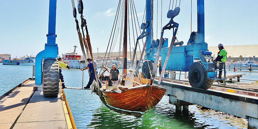 Image of Batavia longboat lifted out of the water by a crane