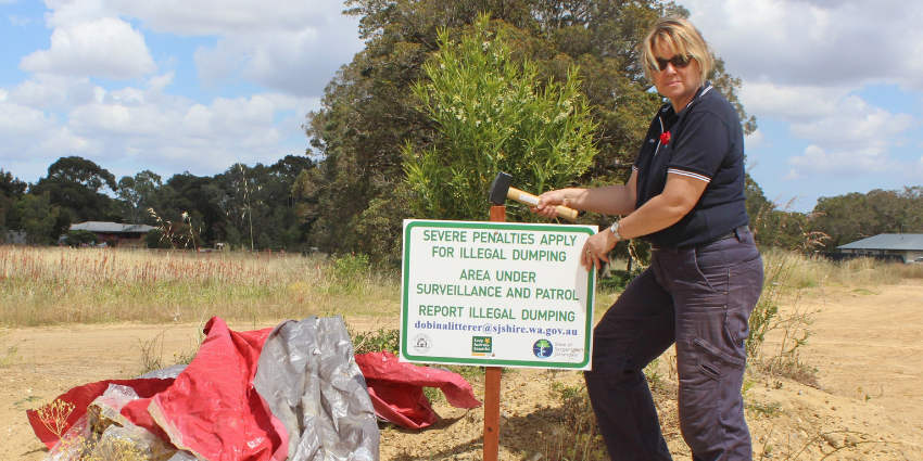 Woman pegging in a sign