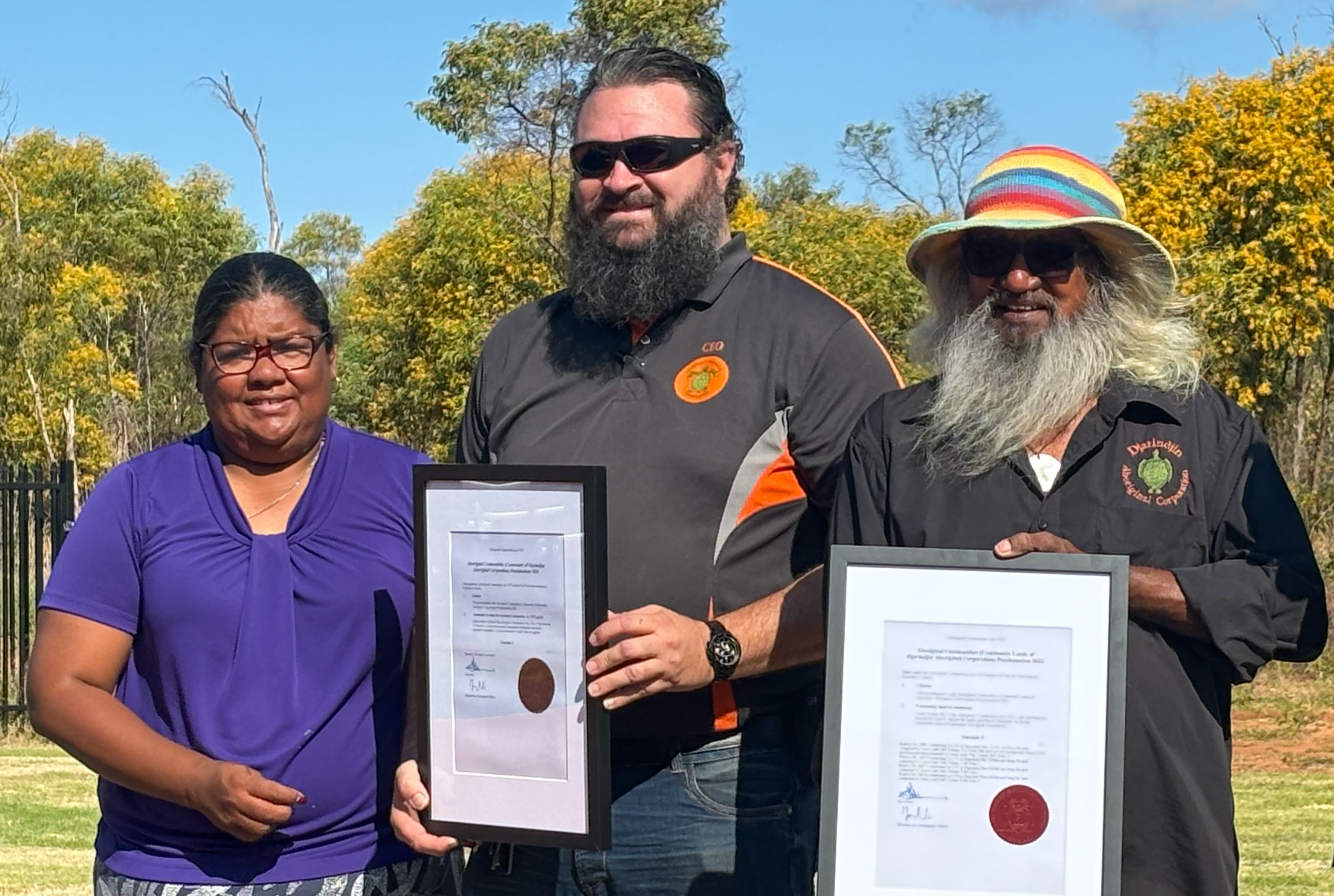 People holding certificate