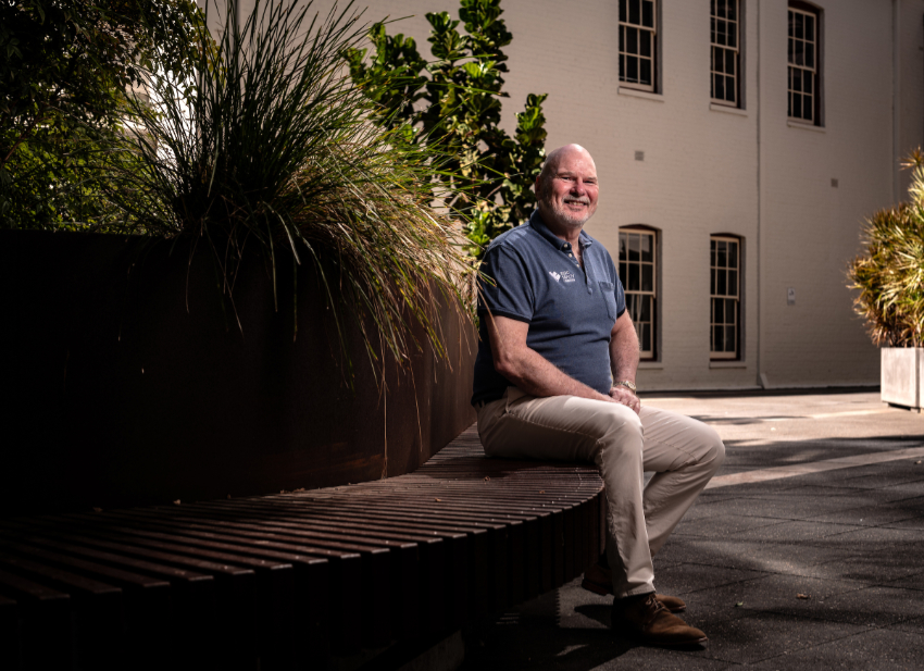Road Safety Commissioner Adrian Warner sitting on a bench
