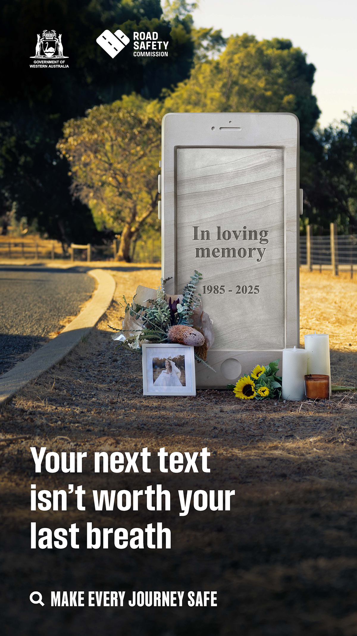 headstone phone on side of road with text, 'your next text isn't worth your last breath'