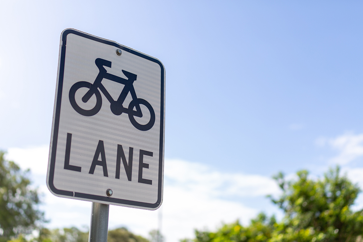 Sign with a graphic of a bicycle with the word "Lane" underneath