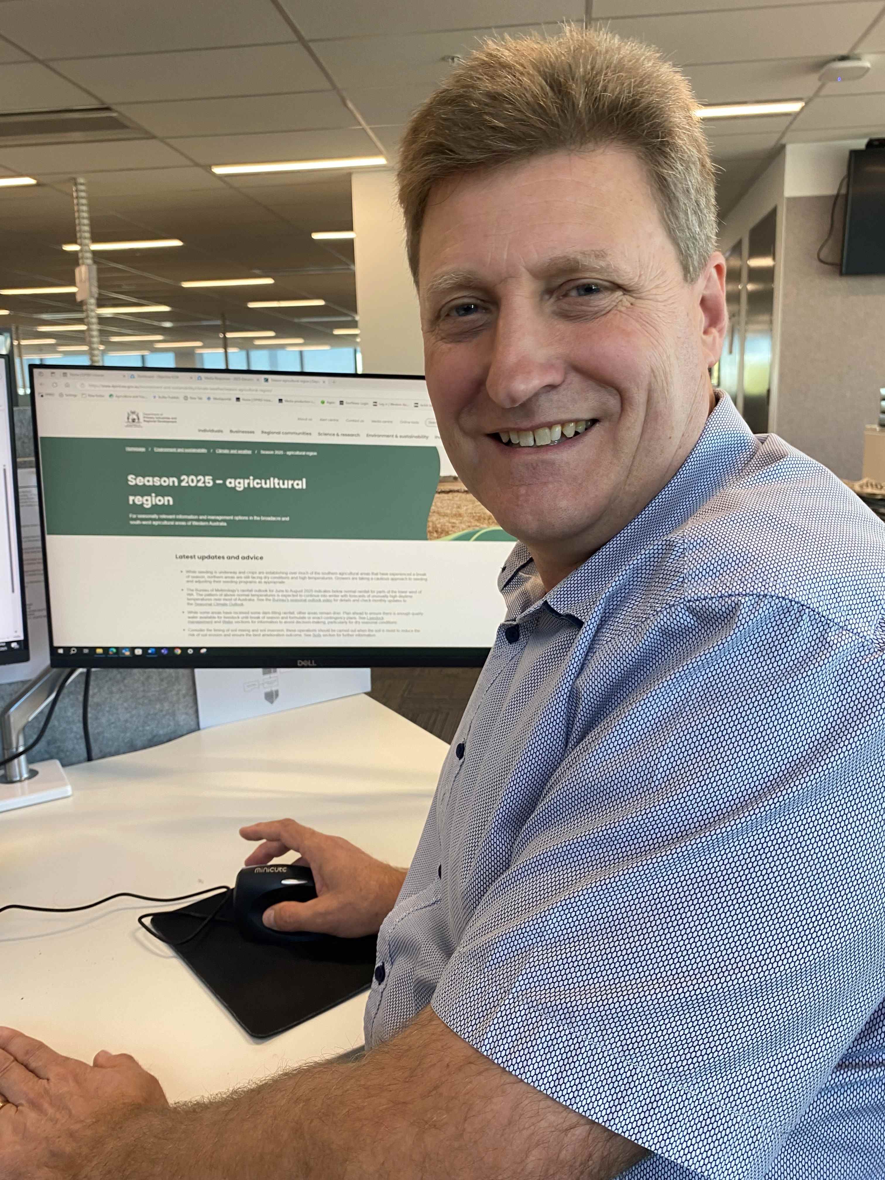 A man sitting at a computer.