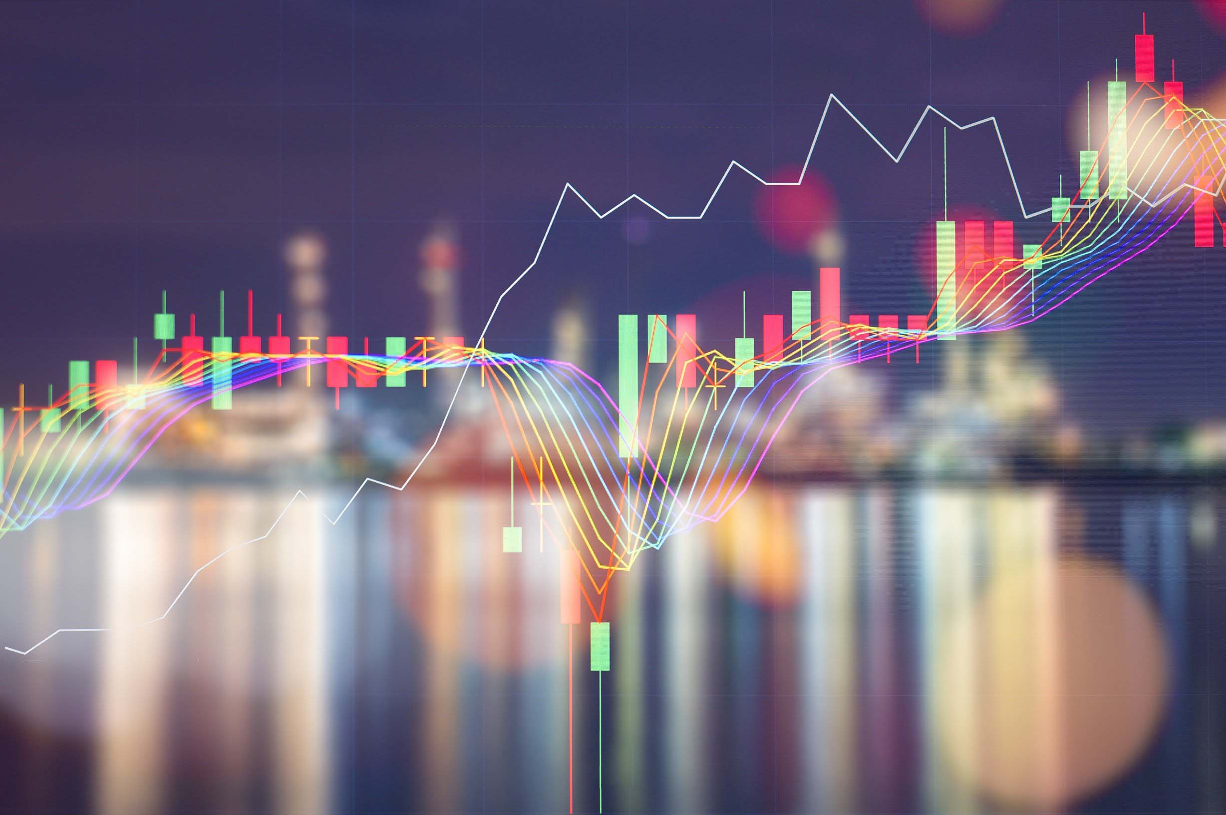 Line chart overlaid on photo of city at night depicting energy markets.