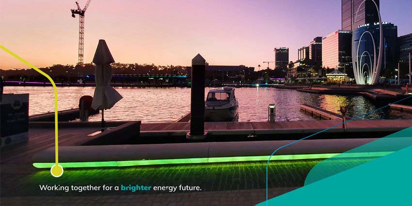 Perth at night with graphic words overlaid on photo which reads - 'working together for a brighter energy future'.