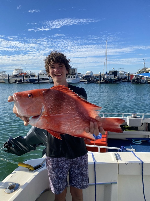 Travis Kirkpatrick with a red emperor he caught off Geraldton