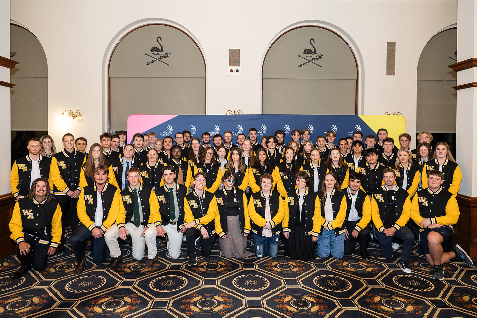 The 74-member team representing Western Australia, wearing their uniforms at a ceremony at Parliament House. 
