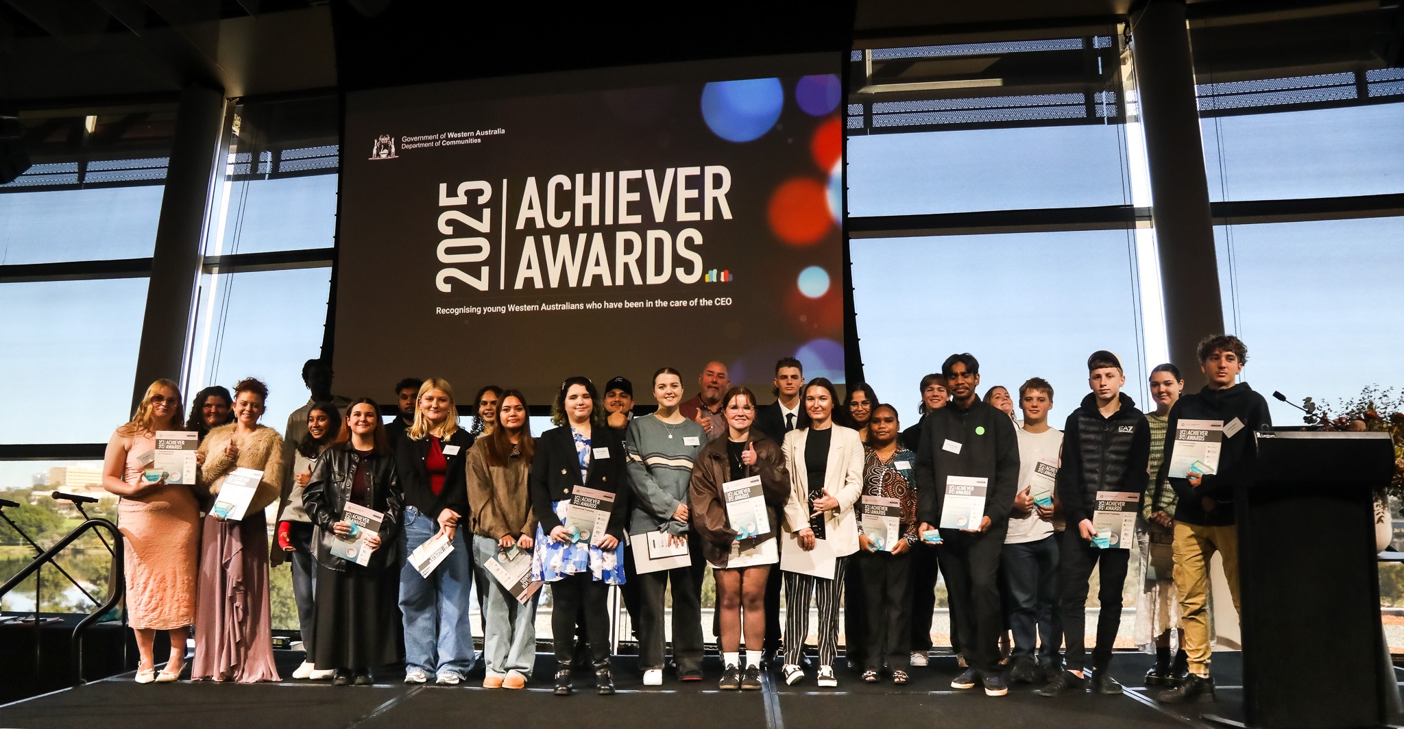 Image of a large group of young people on stage at the 2025 WA Achiever Awards ceremony