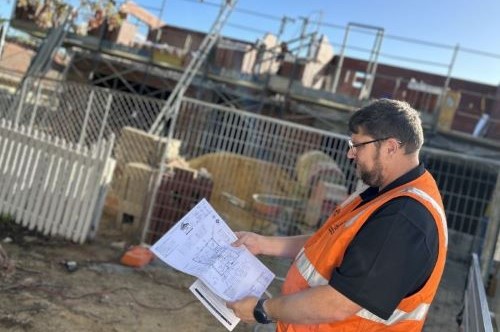 Building Audit team on site looking at plans