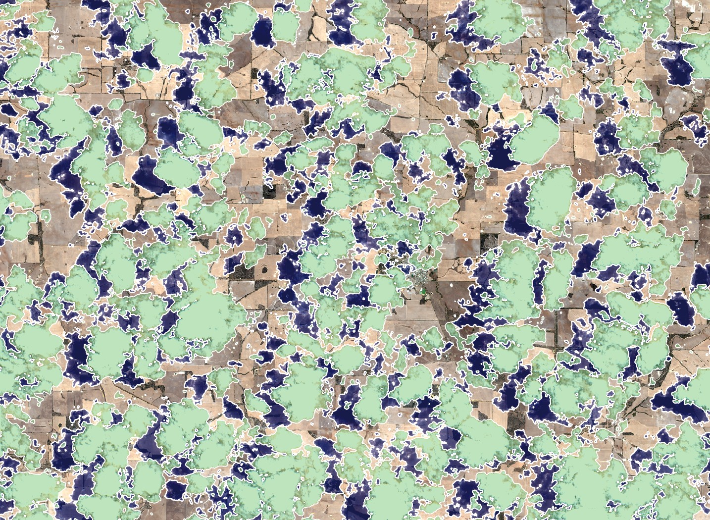 A cloudy satellite image with the OmniCloudMask used to identify the clouds and the cloud shadows in green and blue.