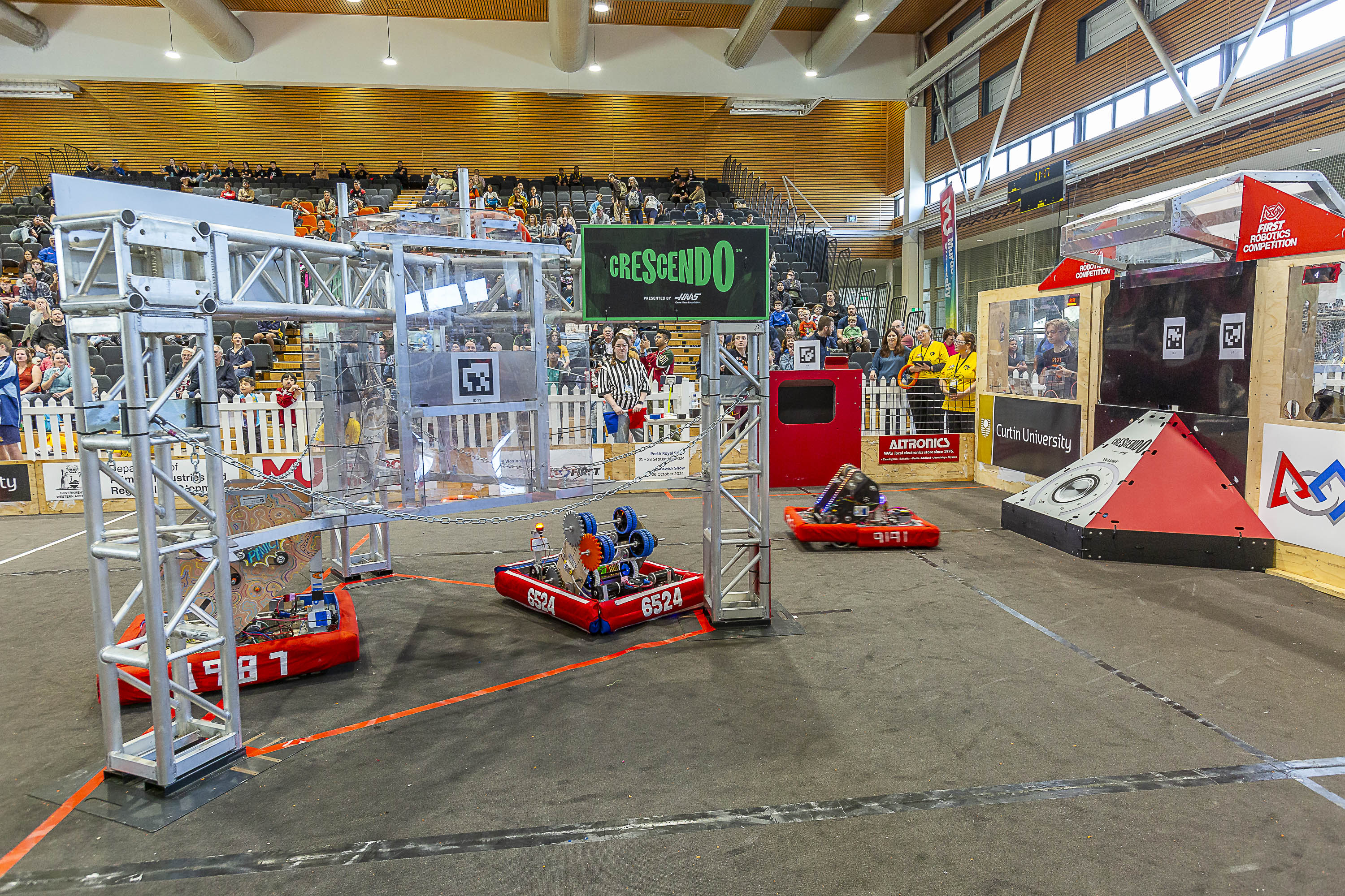 Robots in battle during the 2024 Western Australian Robotics Playoffs.