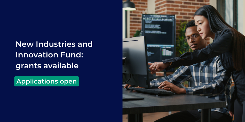 two people working on a desktop computer 