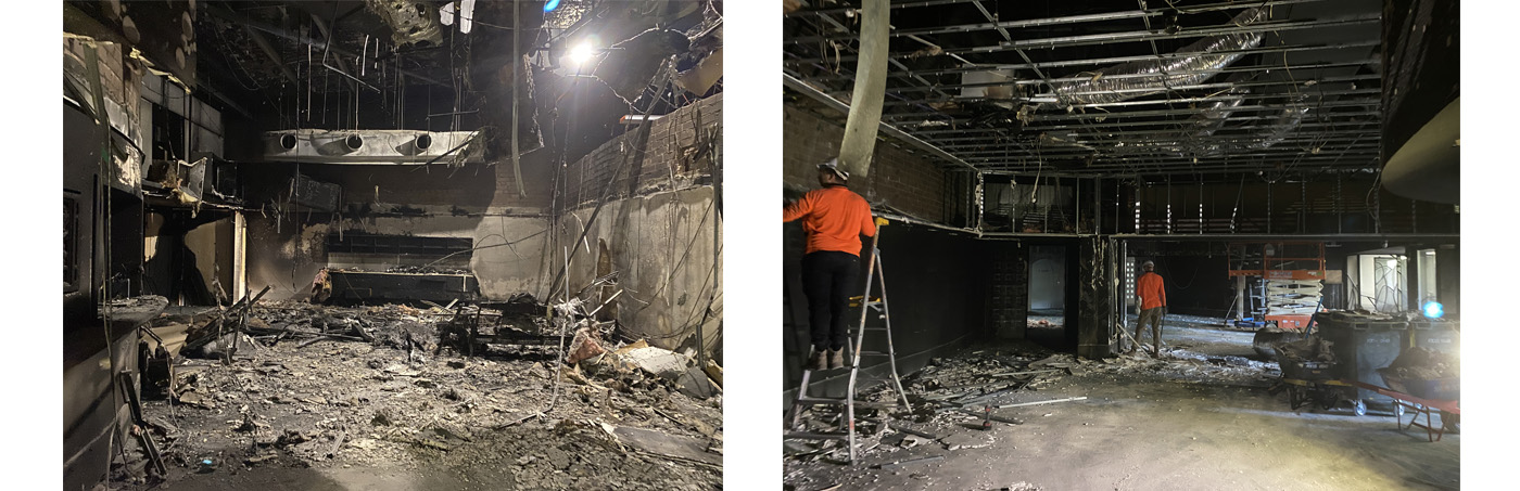 The charred remains of an interior room with the ceiling void exposed and wires and burnt items everywhere