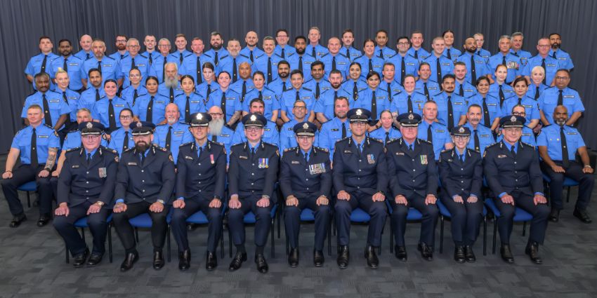 A group of Prison Officer and Senior Leaders at a graduation ceremony