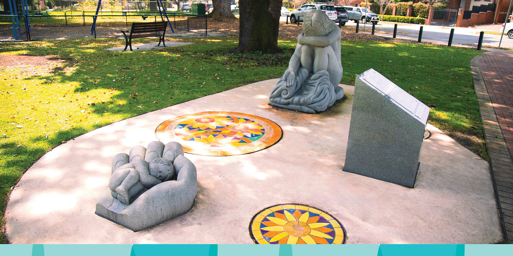 Photo of a memorial sculpture called Empty Arms – Broken Lives, representing mothers separated from their children by adoption. It includes a sculpture of a baby and a crying mother