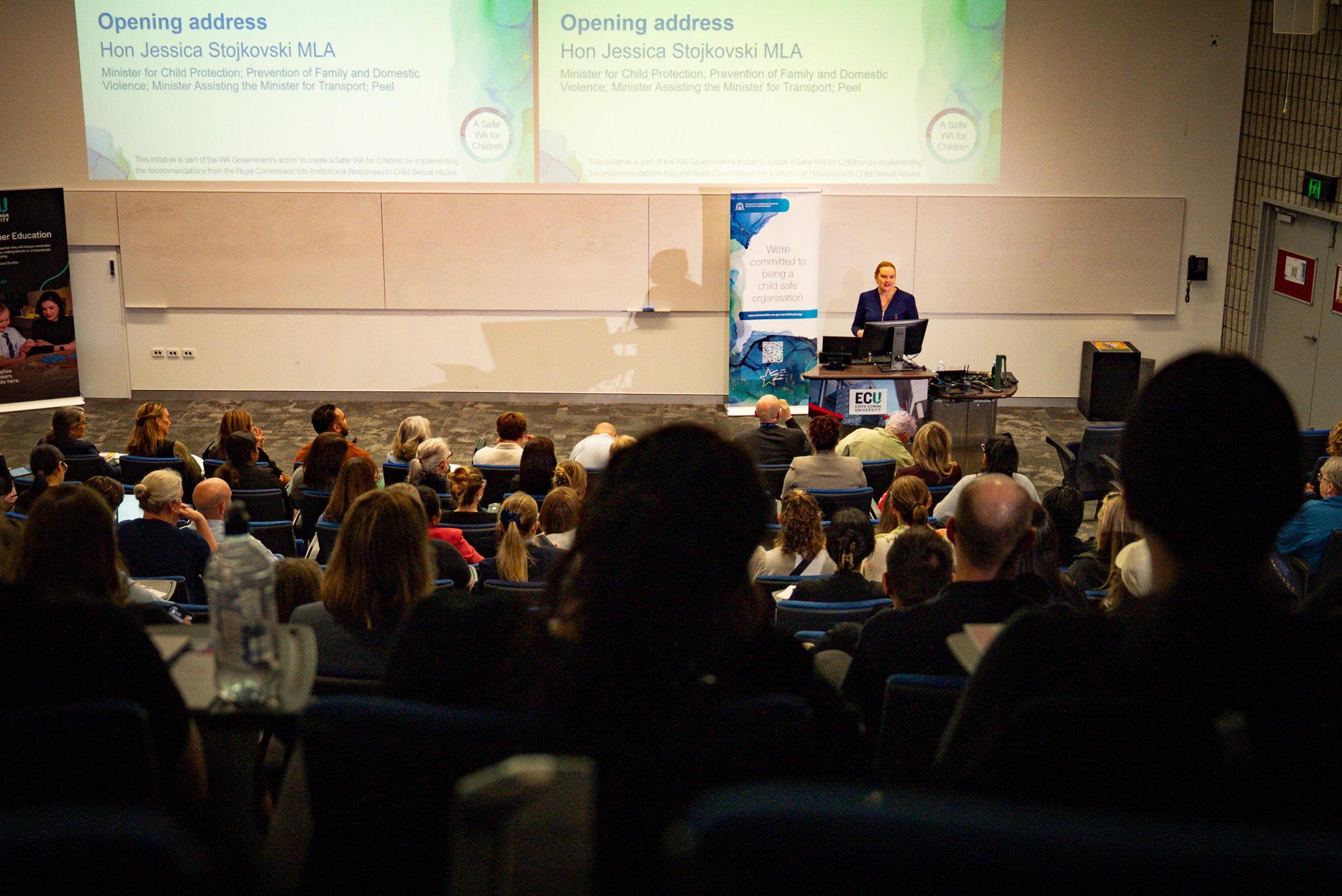 Photo of audience members during the opening address of the seminar