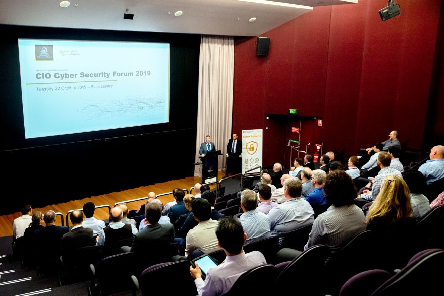 Presentation slide and audience at the CIO Cyber Security Forum