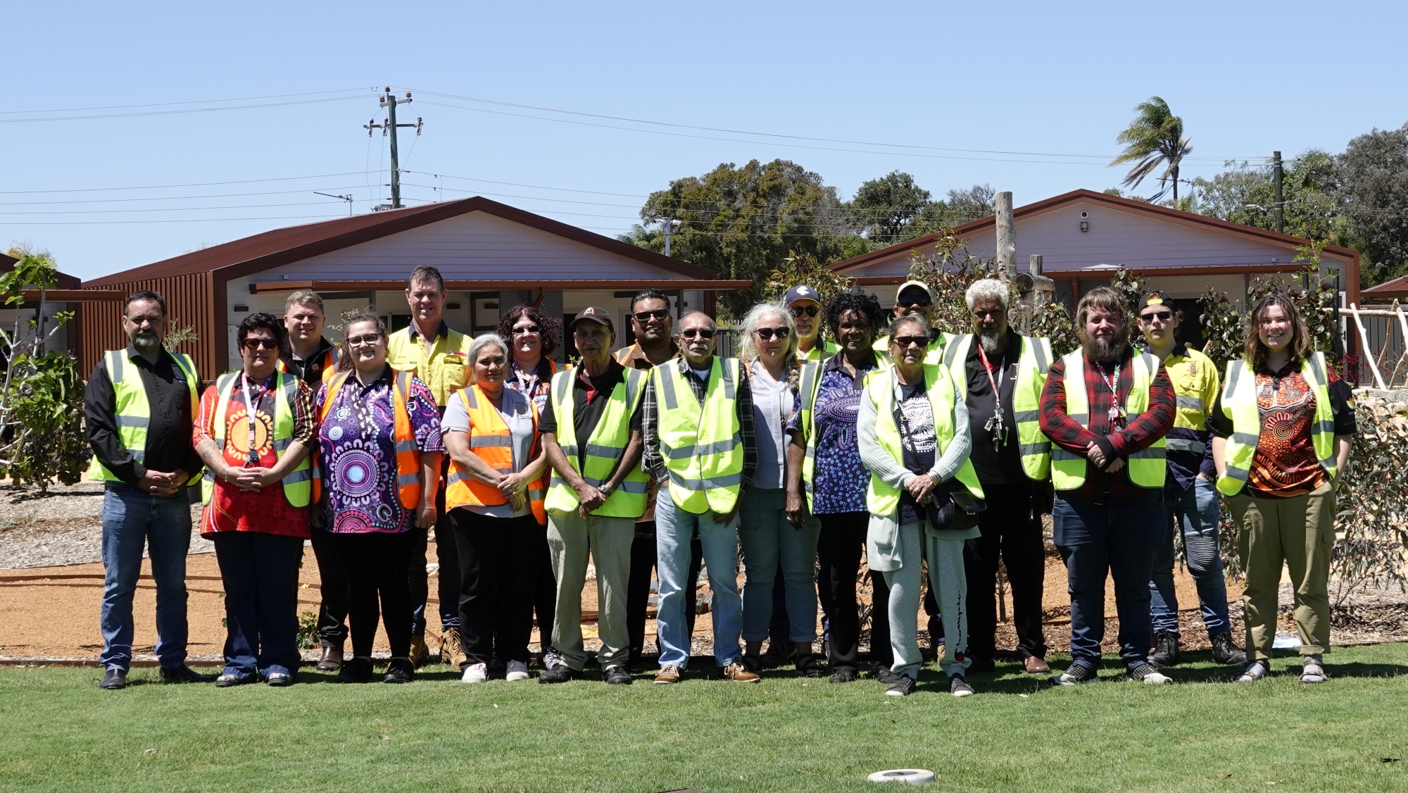 Group photo of about 20 people in an outdoor setting. They are Bundiyarra and GBSC Yurra staff at the Geraldton Short Stay