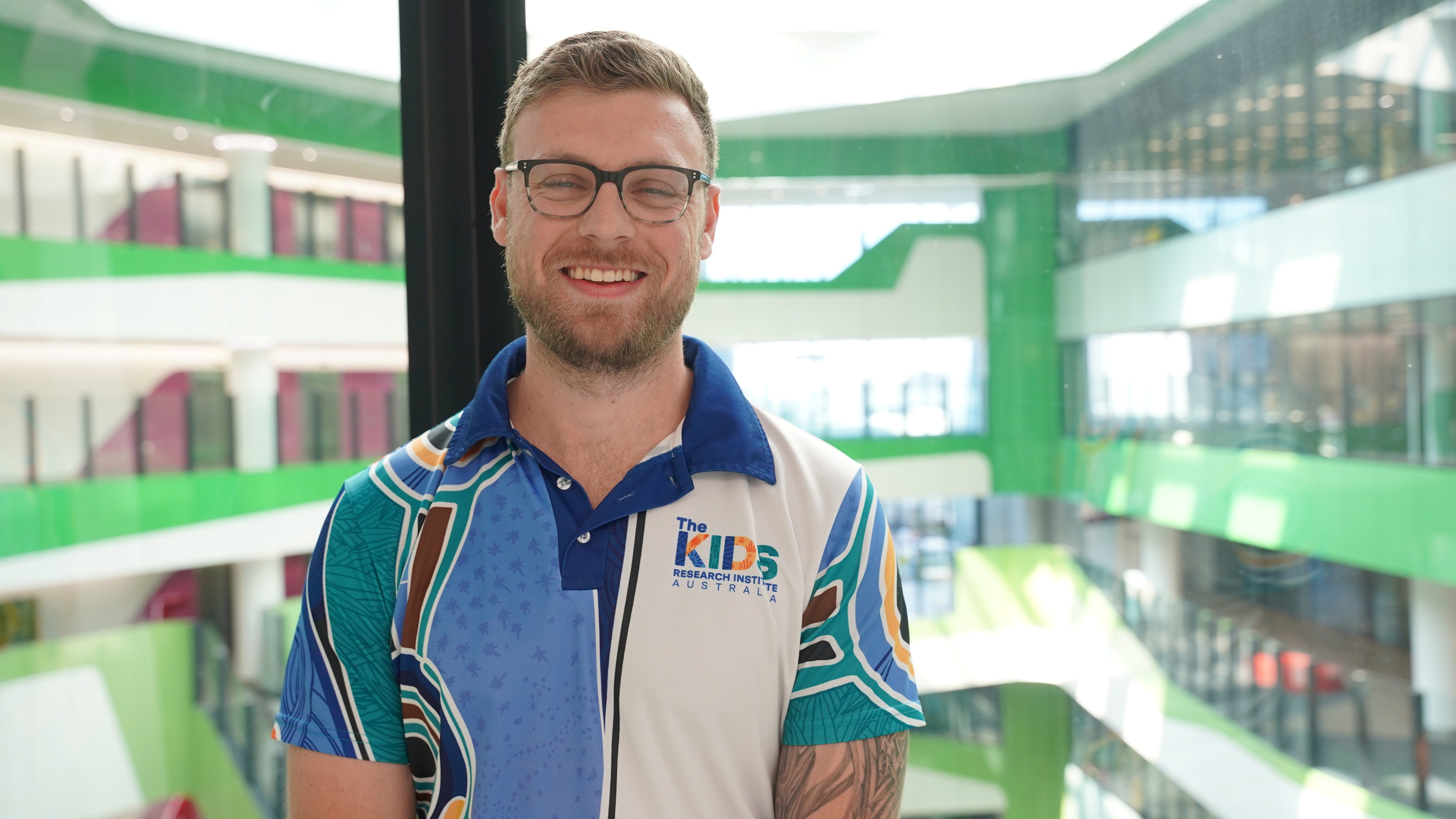 psa finalist michael dymock standing in The Kids Research uniform